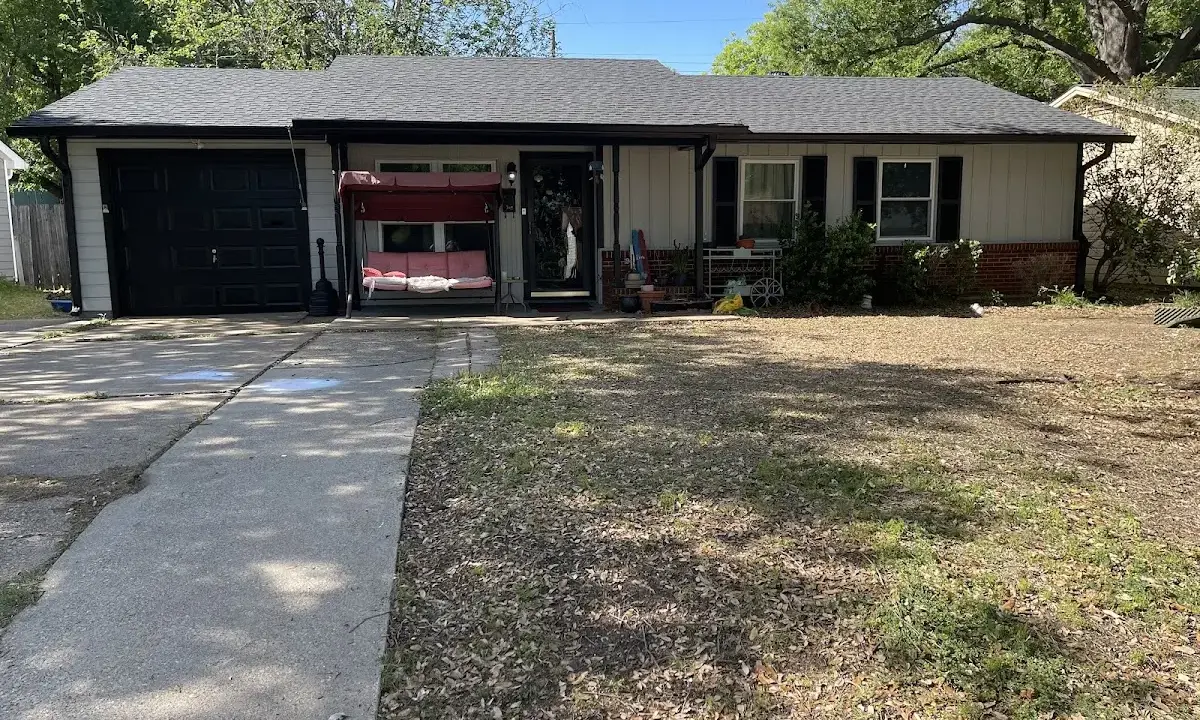 Asphalt Shingle Roof Repair crew at work on a residential roof in Smyrna